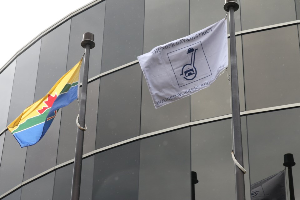 An Injured Workers' flag was raised Thursday at City Hall (Michael Charlebois, tbnewswatch.com)