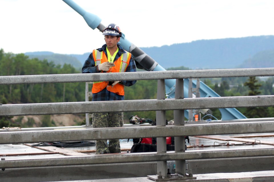 A worker on the Nipigon River Bridge on Thursday, June 29. 2017 (Leith Dunick, tbnewswatch.com). 