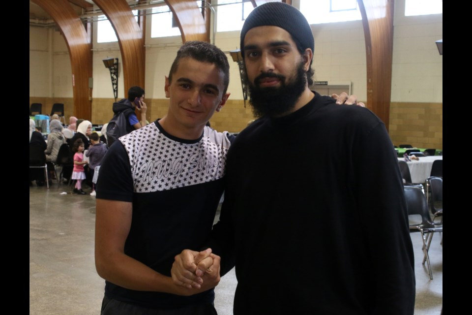 Taha Bhaboa, a grade 8 student from Syria celebrates his first Eid al-Fitr in Thunder Bay with Imam Hikma of the Thunder Bay Masjid, 