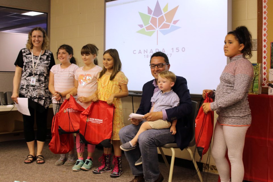 MP Don Rusnak handed out prize packages to the top four readers from St. Francis Elemntary School on Tuesday. (Michael Charlebois, tbnewswatch.com)