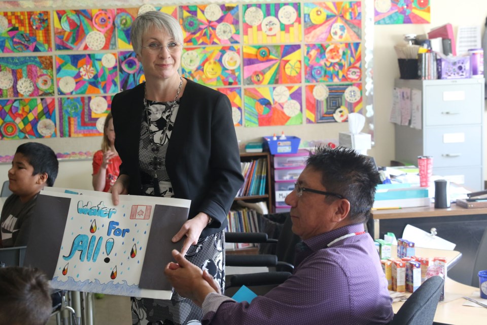 Patty Hajdu and Alvin Fiddler after listening to the presentation from the Grade 5/6 class at St. Pius school. (Michael Charlebois, tbnewswatch.com)