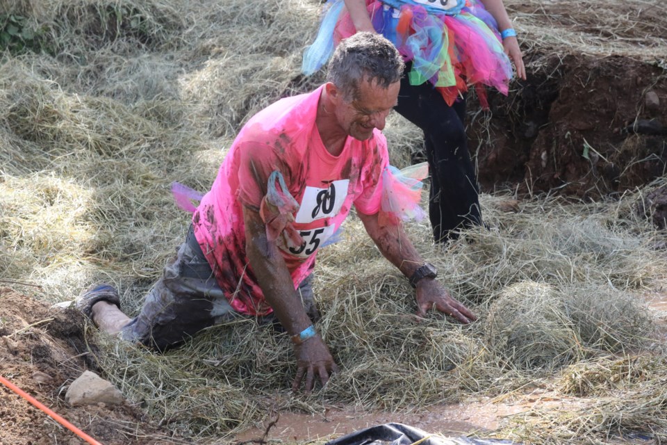 Johnny Doughty takes in the mud after a face-first dive. (Michael Charlebois, tbnewswatch.com)