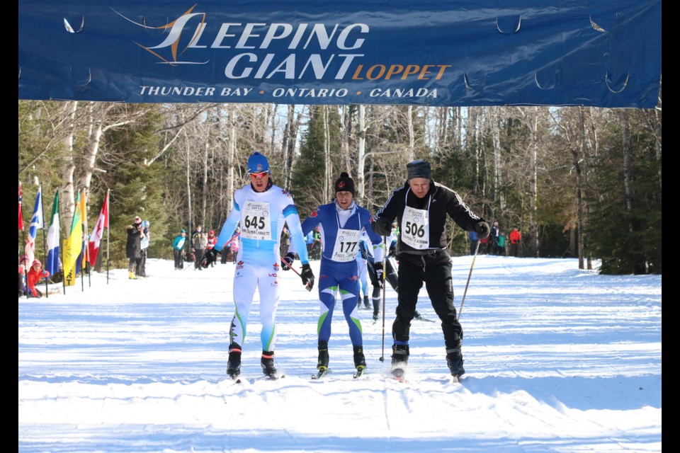 Evan Palmer-Charrette (left), crosses the finish line just ahead of Andy Shields in the men's 50K Freestyle at the Sleeping Giant Loppet on Saturday, earning him his second Loppet win. (Photos by Doug Diaczuk - tbnewswatch.com). 