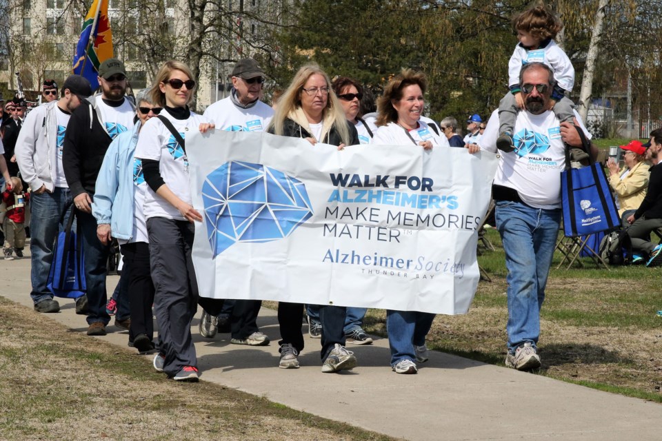 The honouree Alkenbrack family carrying the Alzheimer's society banner, and leading the pack. (Michael Charlebois, tbnewswatch.com)