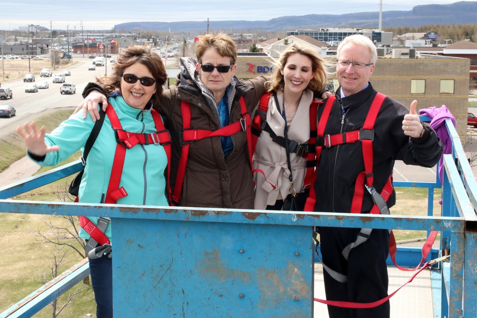 Staff at the Children's Centre Thunder Bay took part in the United Way's 25th annual Billboard Rescue on Thursday, May 18, 2017. From left: Norine Carroll, CEO Diane Walker, Vanessa Copetti and vice-president John Friday (Leith Dunick, tbnewswatch.com). 