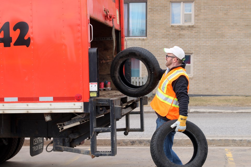 Alan Forbes, cage shift manager with the Thunder Bay OLG Casino, loads tires during the annual e-waste and tire collection at the OLG Casino parking lot. 