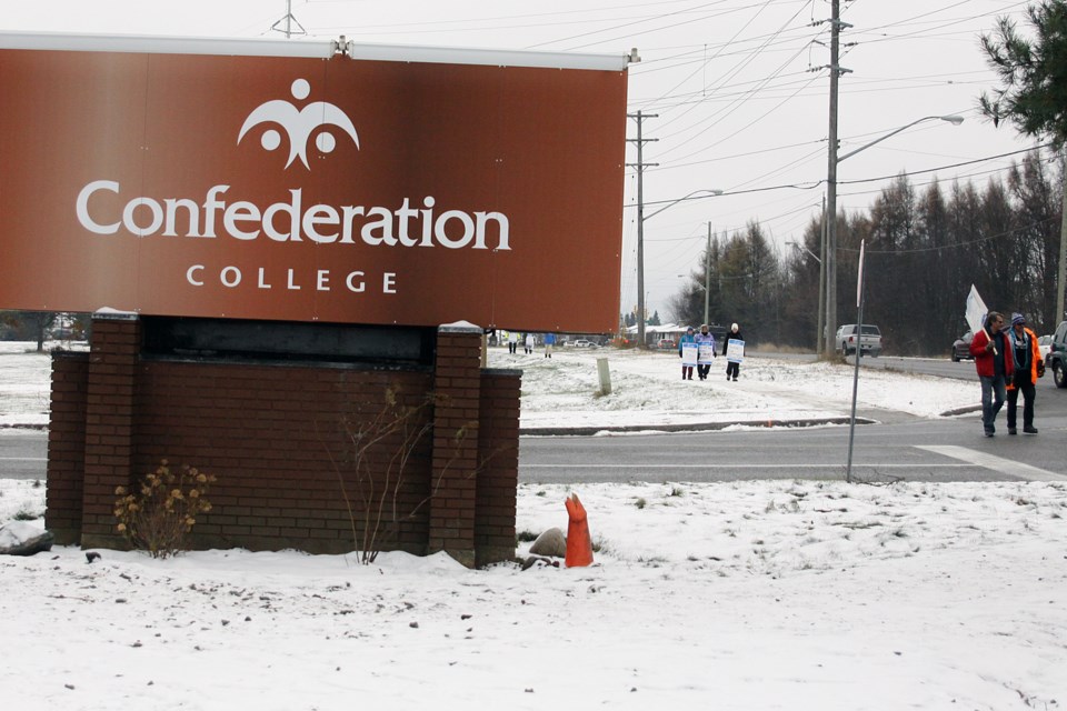 Members of the Ontario Public Service Employees Union Local 732 demonstrate outside the Confederation College campus on Tuesday. (Matt Vis, tbnewswatch.com)