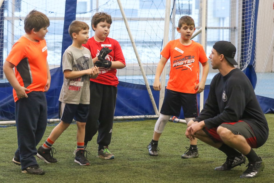 Nigel Romick with participants from 2016's Training With a Pro