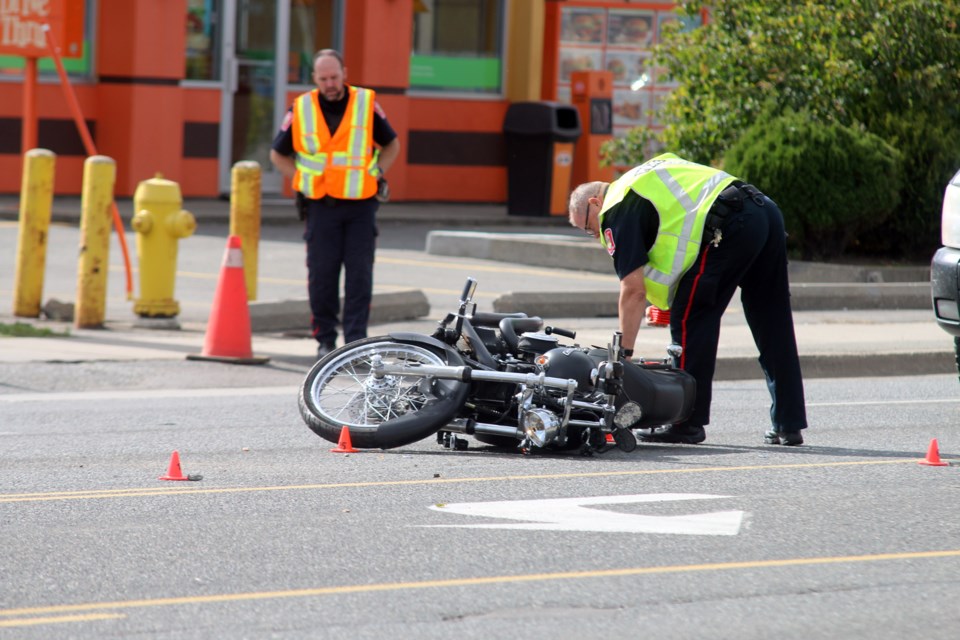 Police continue to investigate a collision involving a motorcycle on Arthur Street. (Photos by Doug Diaczuk - Tbnewswatch.com). 