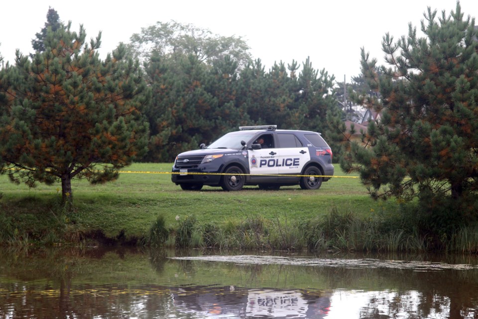 Police are holding the scene on the banks of the McIntyre River after a body was discovered in the water Saturday afternoon. (Photos by Doug Diaczuk - Tbnewswatch.com).  