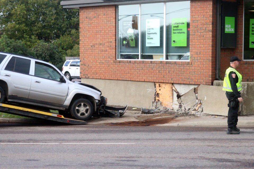 Police were on the scene after a vehicle ran into a building on Red River Road Saturday morning. 