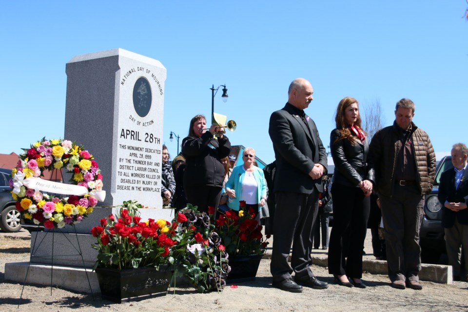 Workers, union representatives, employers, and political leaders gathered at the memorial outside the Finlandia Hall honouring workers who have been killed or injured on the job during the National Day of Mourning. (Photos by Doug Diaczuk - Tbnewswatch.com). 