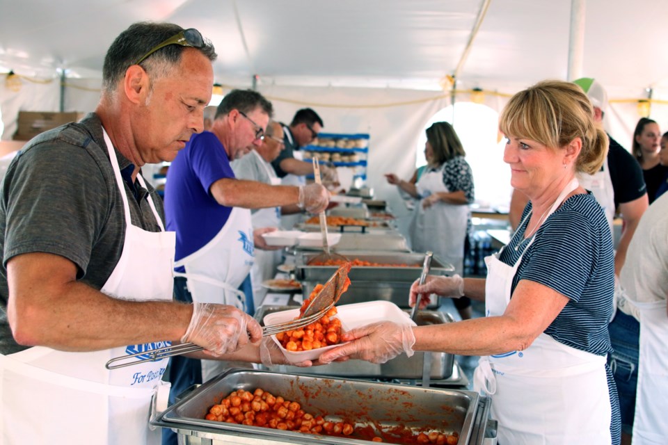 Vincenzo Sottile (left) and Donna Stuber were busy serving up some traditional Italian dishes during the 28th Annual Festa Italiana on Sunday. (Photos by Doug Diaczuk - Tbnewswatch.com). 