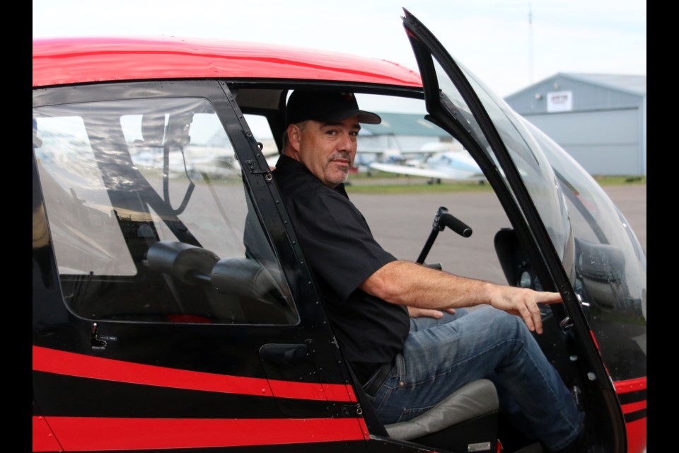 Liam Dowds, lead and pilot with Northwest Heli-tours and Adventures, is getting ready to start offering tours out of the city's waterfront this weekend. (Photos by Doug Diaczuk - Tbnewswatch.com). 