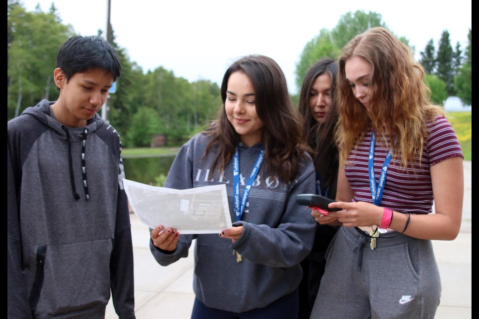 Deiken Turtle, Zoey Sawdo, Kaley Kakegamic, and Emily Ottertail practice using a GPS during a geocaching exercise at Lakehead University during the Outland Youth Employment Program. (Photos by Doug Diaczuk - Tbnewswatch.com). 