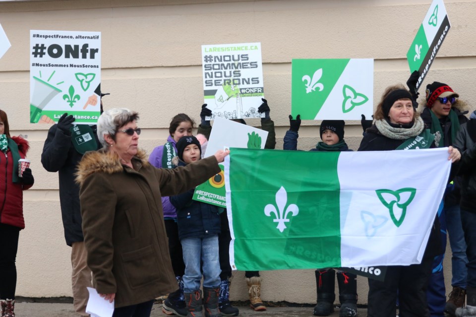 Members of the Francophone community held a rally outside MPP Judith Monteith-Farrell's (left) constituency office on Saturday to protest recent cuts to French-language programs by the provincial government. (Photos by Doug Diaczuk - Tbnewswatch.com). 