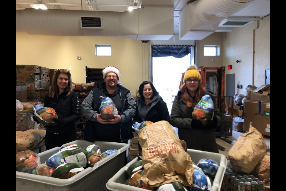 Board members delivered the groceries to the Regional Food Distribution Ass'n (submitted photo)