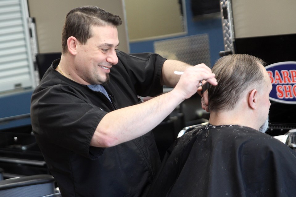 The Barber Shop owner Bryan Fresco does a haircut on Thursday, December 6, 2018. (Matt Vis, tbnewswatch.com)