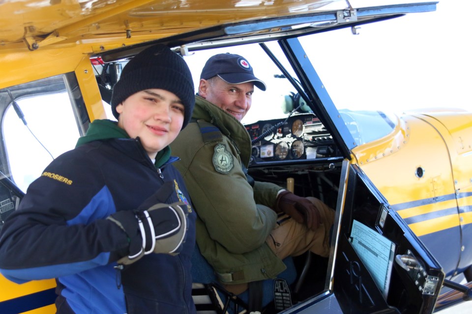 Air cadet Terrance Desrosiers (left) and Capt. Steve Skerlan back on the tarmac after Terrance's first flight in a single-engine plane during familiarization flights at the Thunder Bay International Airport. (Photos by Doug Diaczuk - Tbnewswatch.com). 