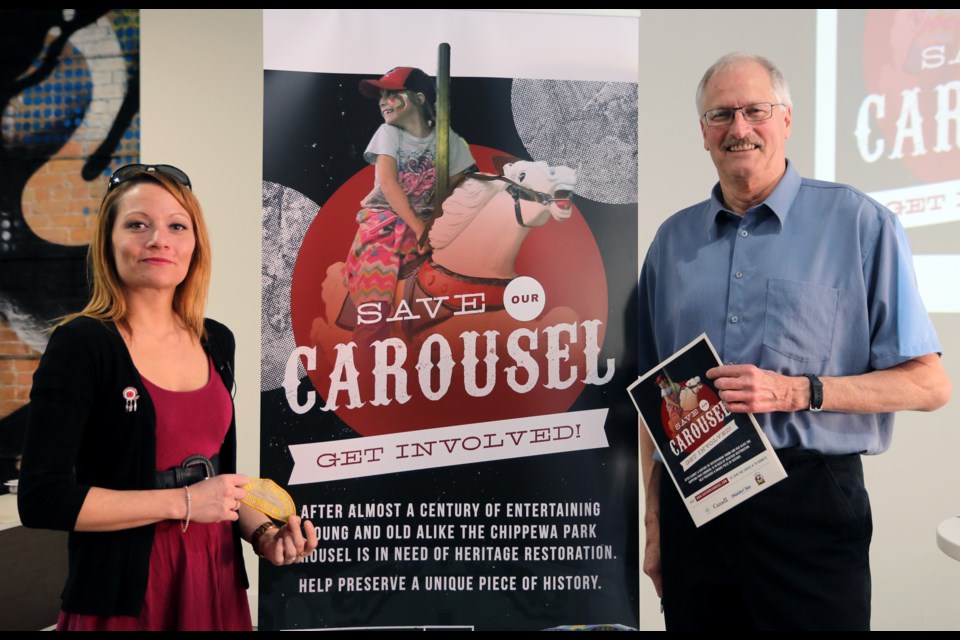 Kateri Banning (left) is the first to adopt a horse as part of the capital campaign to raise money for the restoration of the Chippewa Park Carousel, which was launched on Tuesday with new capital campaign chair, Jules Tupker (right). (Photo by Doug Diaczuk - Tbnewswatch.com). 