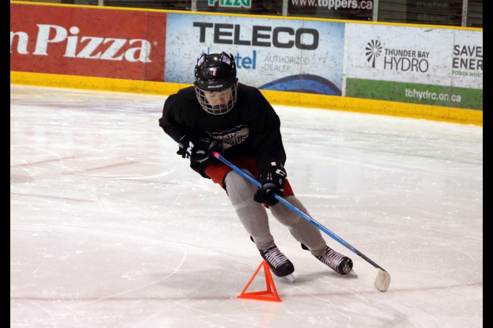 William Seaberg takes a sharp corner during hockey drills led by members of the Thunder Bay North Stars and Junior B league teams. 
