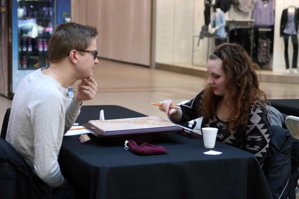 Brant Muir and Victoria Methot go head to head in a close game of Scrablle during the 20th Annual Scrabble Fundraising Tournament hosted by the Thunder Bay Literacy Group on Saturday. 