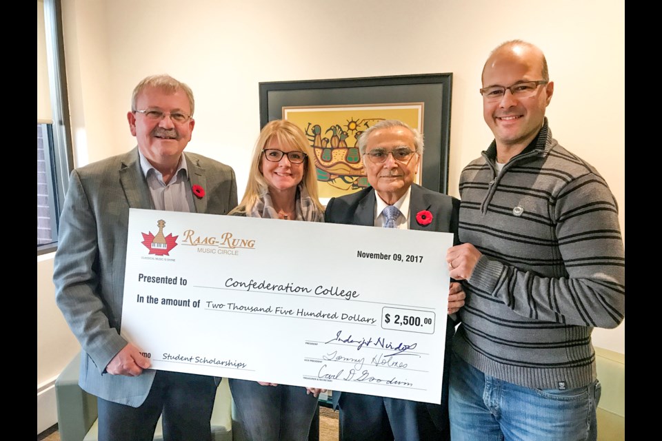 From left to right: Dr. Jim Madder (College President), Tammy Holmes, Inder Nirdosh and Rajesh Talpade. 