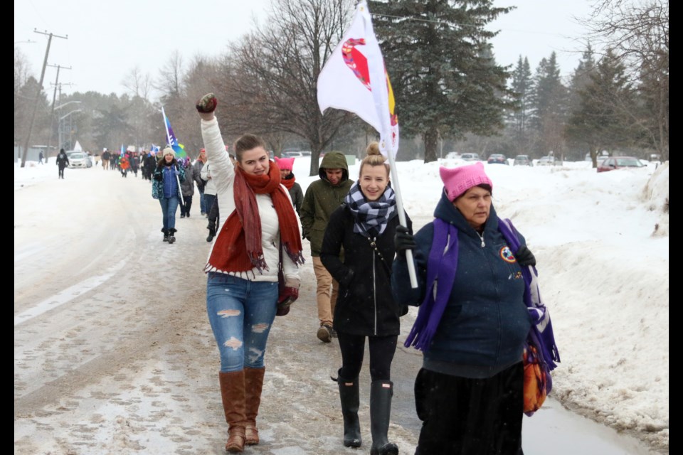 Jacqueline Dyck (left) marches in the Women's March in Thunder Bay on Saturday. Events are being held across the globe to speak out for women's rights and promoting more women in politics. (Photos by Doug Diaczuk - Tbnewswatch.com). 