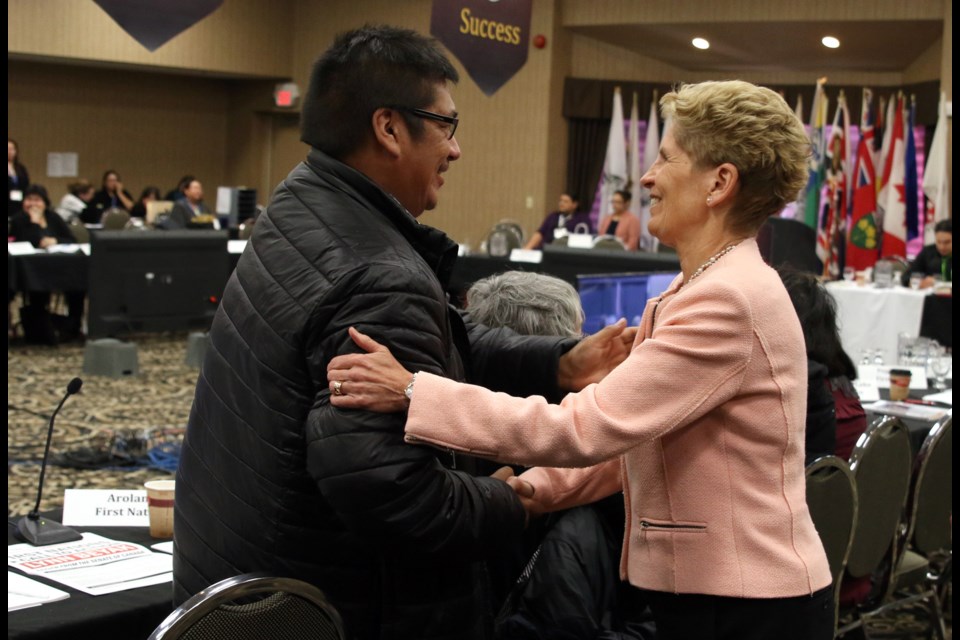 Neskantaga First Nation chief, Wayne Moonias, shakes hands with Ontario Premier Kathleen Wynne following her address at the NAN Chiefs Winter Assembly in Thunder Bay. (Photos by Doug Diaczuk - Tbnewswatch.com). 
