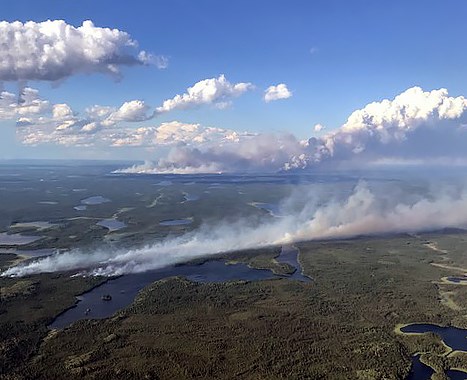 Two fires in the Summer Beaver area are visible here, one in the centre of the photo and the much larger one in the distance (courtesy MNRF)