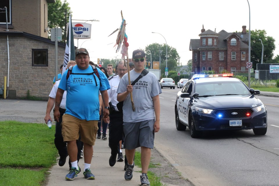 The Hope in the Darkness took police, Indigenous leaders, and local youth down Arthur Street Friday. (Michael Charlebois, tbnewswatch.com)