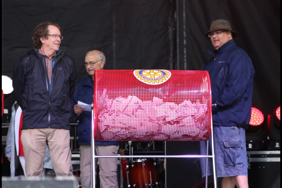 Sante Sottile (middle), president of Fort William Rotary, along with Rotary members Dave Knutson (right), and Andy Morrow get ready to draw the winning ticket in the Rotary House Lottery Draw on Sunday. (Photos by Doug Diaczuk - Tbnewswatch.com). 