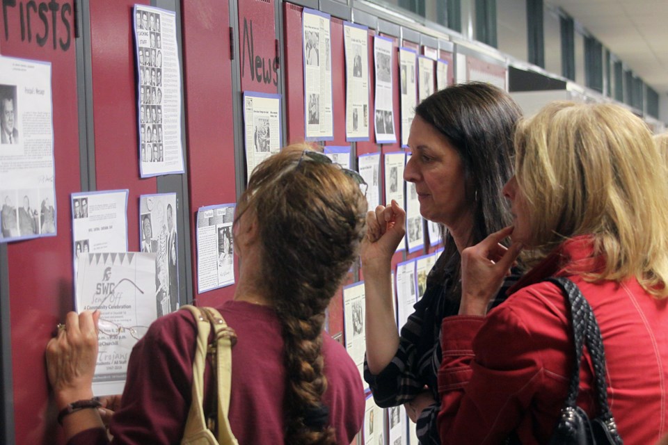 People check out displays of Sir Winston Churchill Collegiate and Vocational Institute's history at the school's send-off on Friday, June 8, 2018. (Matt Vis, tbnewswatch.com)