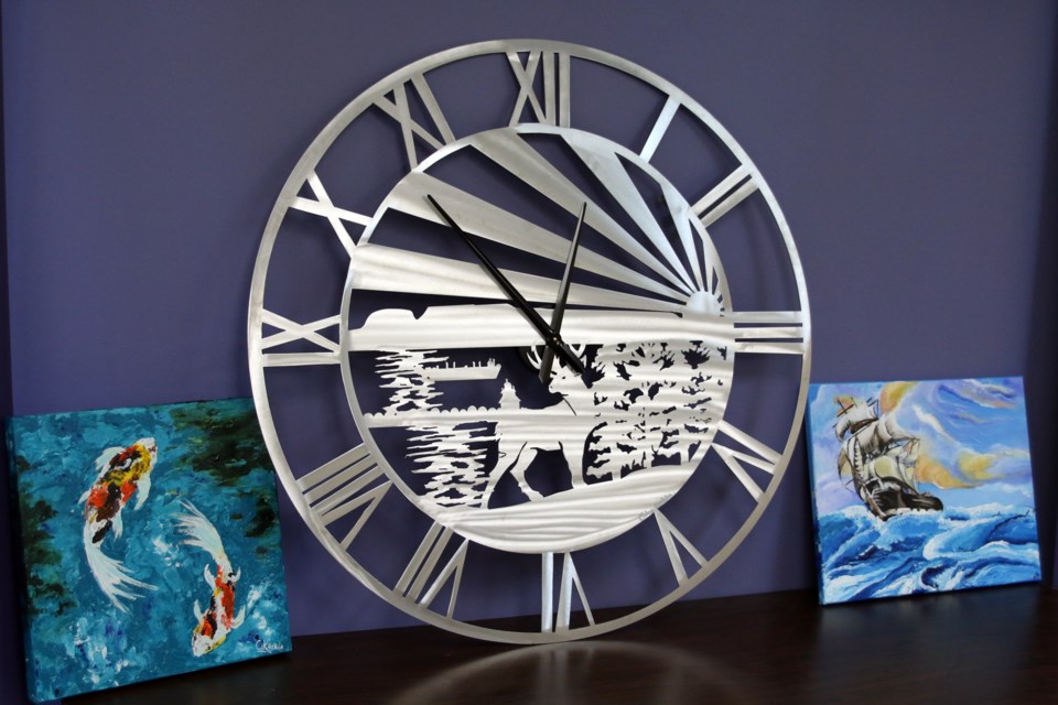 The large clock, by Chloe Kuchta, a grade 12 student at Superior High School, will hang in the waiting area at the Lakehead Nurse Practitioner's Clinic. 