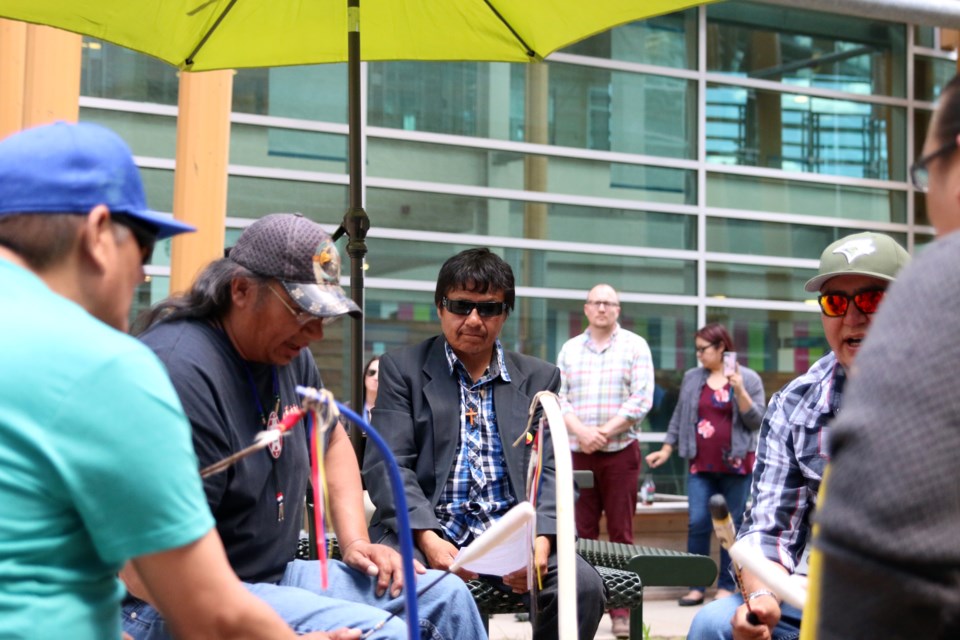Garry Sugarhead (centre) listens to traditional drums during a ceremony at the Thunder Bay Regional Health Sciences Centre after he completed a 700 kilometre walk for diabetes awareness. (Photos by Doug Diaczuk - Tbnewswatch.com). 