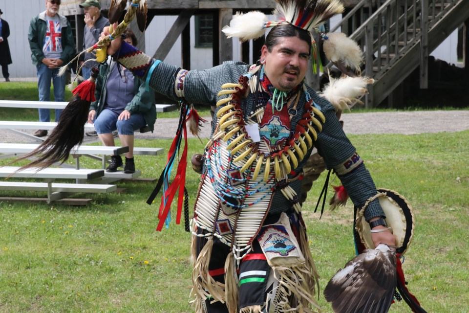 Doug Turner performing a sneak-up dance, wearing men's traditional clothing. (Michael Charlebois, tbnewswatch)