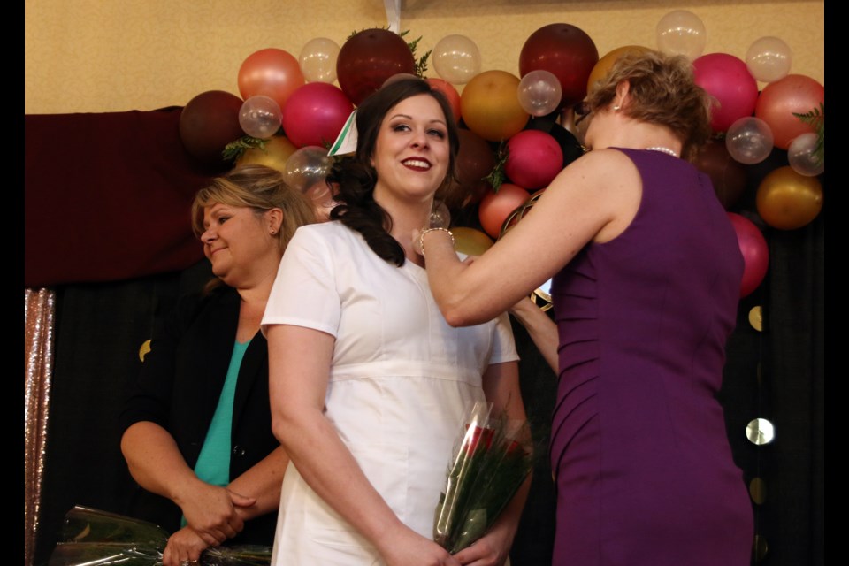 Samara Savoie, a graduate from the practical nursing program at Confederation College and class valedictorian, receives her pin during the pinning ceremony held on Sunday. (Photos by Doug Diaczuk - Tbnewswatch.com). 