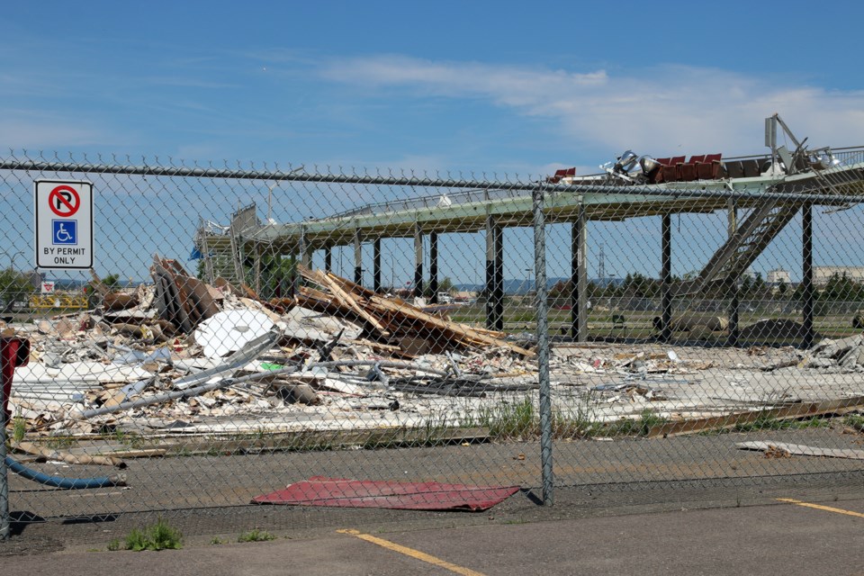 Work is underway to cleanup the site of the collapsed Sports Dome. 