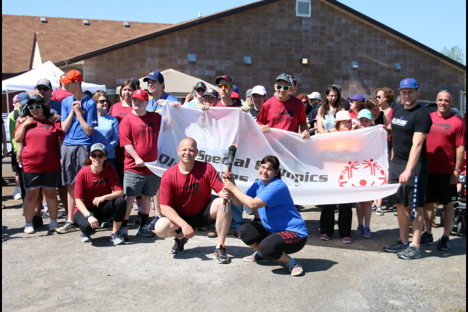 Tannia Falla (right) and Ian West, an officer with the Thunder bay Police Service, get set for the Local Law Enforcement Torch Run on Sunday. (Photos by Doug Diaczuk - Tbnewswatch.com). 