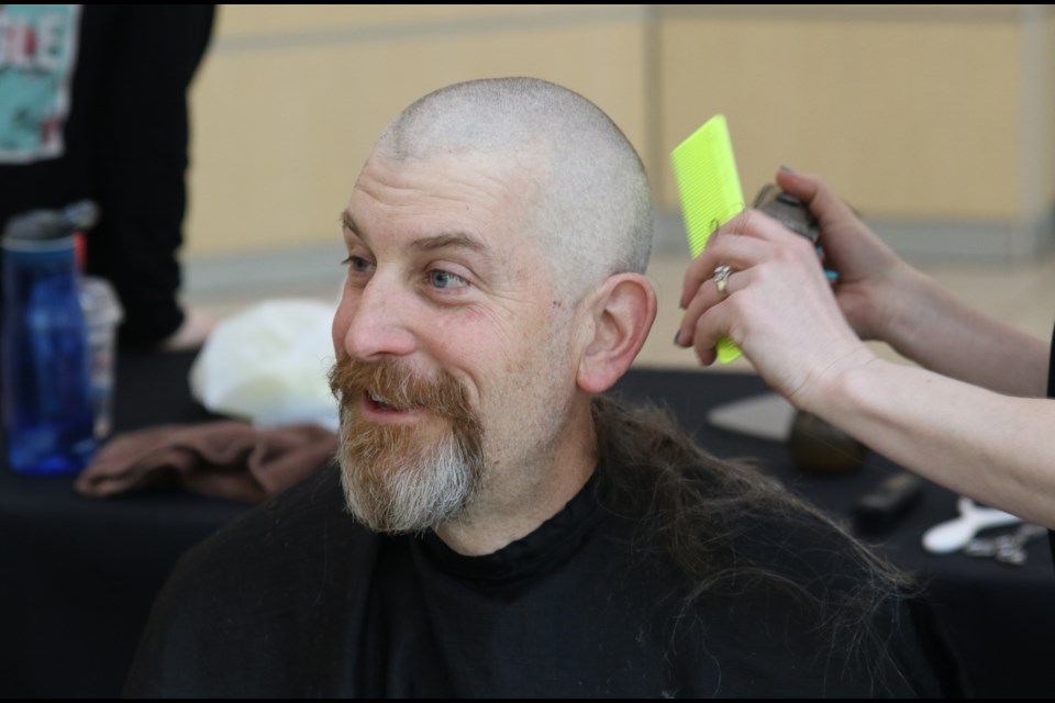 Detective Cst. Robert Miller was given permission to grow curly grey locks in preparation for his Cops for Cancer buzzcut. (Michael Charlebois / tbnewswatch)