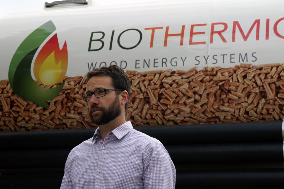 Biothermic president Vince Rutter standing in front of his company's truck which ca carry up to 14 metric tonnes of wood pellets. (Michael Charlebois / tbnewswatch)