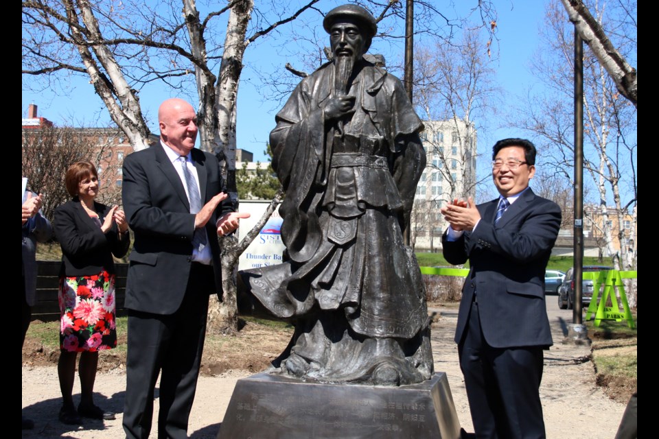 Thunder Bay mayor, Keith Hobbs and Jiaozuo City mayor, Xu Yixian, unveil one of three statues donated by the people of Jiaozuo to the Tai Chi Park on the city's waterfront. (Photos by Doug Diaczuk - Tbnewswatch.com). 