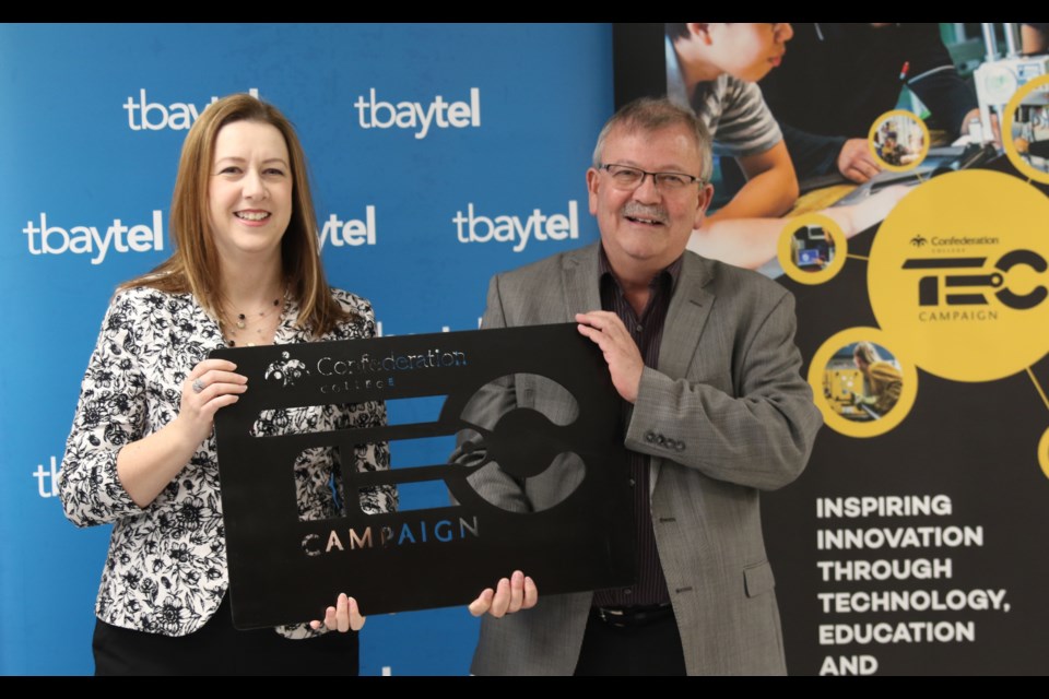 Tbaytel director of marketing and communications Amy Meunier (left) and Confederation College president Jim Madder at a press conference on May 17, 2018. (Michael Charlebois/tbnewswatch)