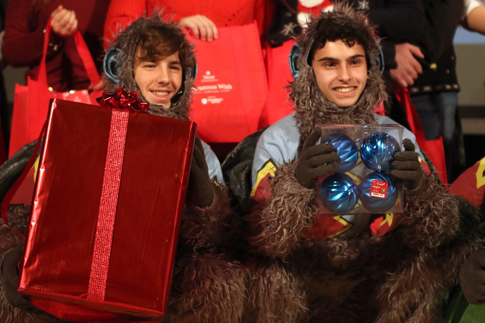 Gianni Mascarin (left) and Paul Stoppel help kick off Dilico Anishinabek Family Care's Christmas Wish campaign on Friday, Nov. 23, 2018 at St. Patrick High School. (Leith Dunick, tbnewswatch.com)