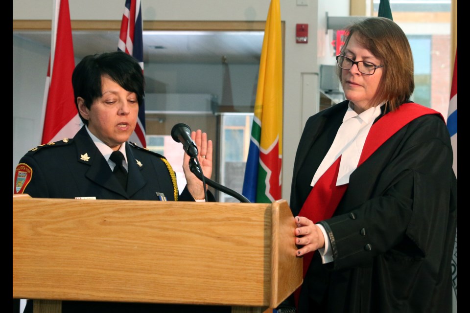 Sylvie Hauth (left) is sworn in as chief of the Thunder Bay Police Service by Justice Elaine Burton during a ceremony on Tuesday. (Photos by Doug Diaczuk - Tbnewswatch.com). 