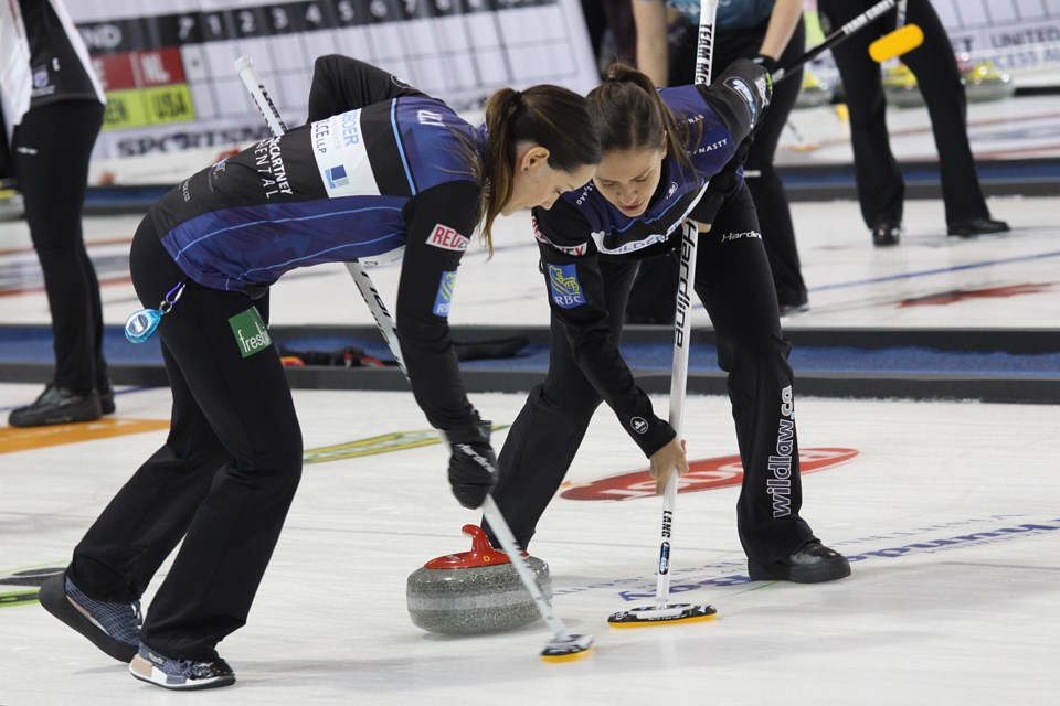 Team McCarville's Kendra Lilly and Sarah Potts sweep during their Pinty's Grand Slam of Curling Tour Challenge game against Team Walker at the Thunder Bay Tournament Centre on Tuesday, November 6, 2018. (Matt Vis, tbnewswatch.com)