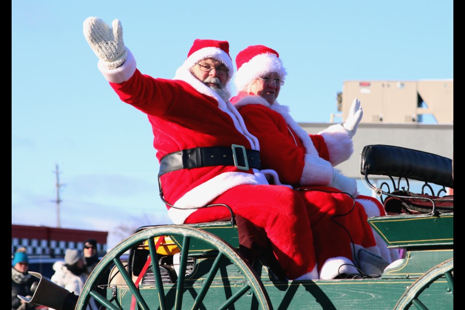 Santa and Mrs. Claus wave to the spectators lining the streets for the 28th Annual Rotary Santa Claus Parade on Saturday. (Photos by Doug Diaczuk - Tbnewswatch.com). 