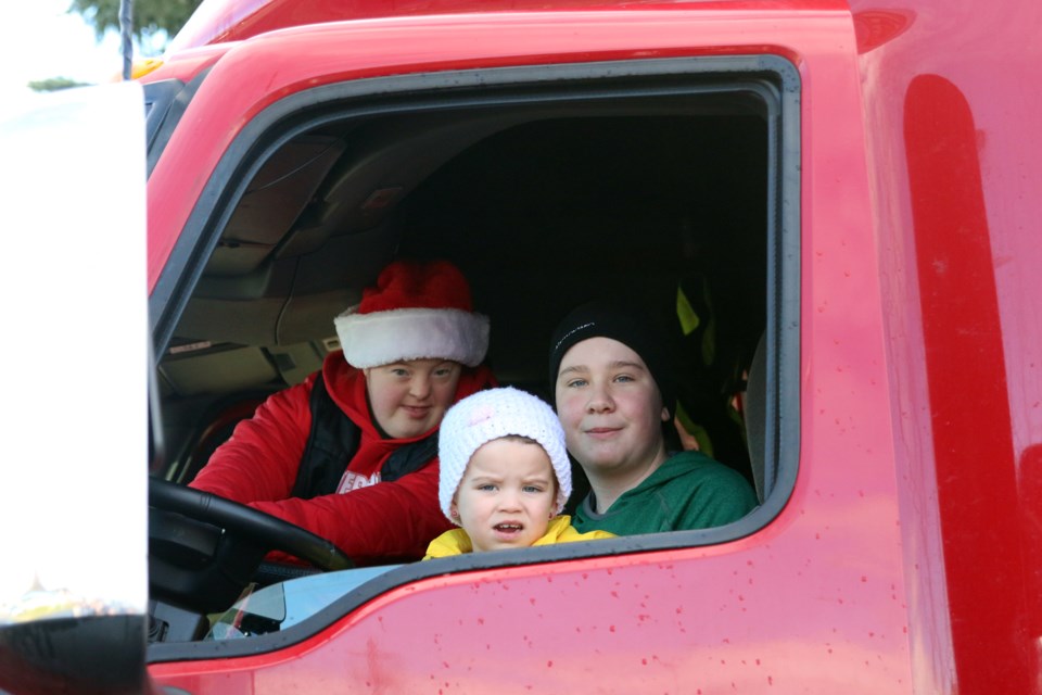 Alex Johnstone (left), Brynn Herron, and Max Busque are three of the four parade marshals during this year's Parade of Lights. (Photos by Doug Diaczuk - Tbnewswatch.com). 