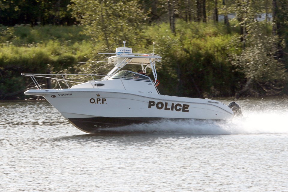 The OPP Dive Team assists on Saturday, Sept. 1, 2018 after a man's body was pulled from the Kaministiquia River. (Leith Dunick, tbnewswatch.com)