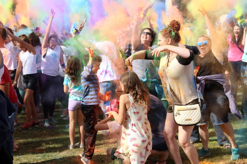 The Festival of Colours saw thousands of people cast their worries away in colourful clouds on Sunday. (Photos by Doug Diaczuk - Tbnewswatch.com). 